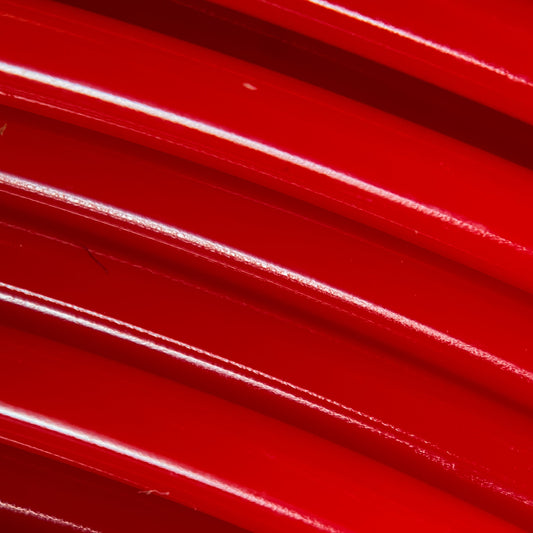 Cookiecad Candy Apple Red PLA filament close-up – glossy red surface detail