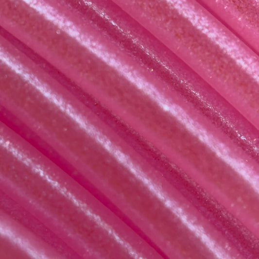 Cookiecad Bubblegum Elixir PLA filament close-up – iridescent shimmer on pink base