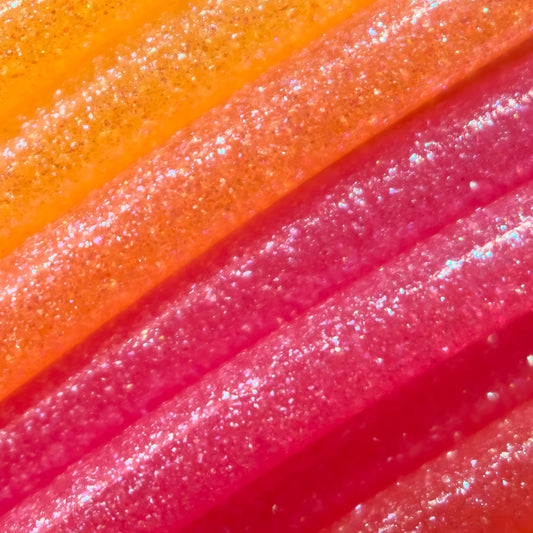 Cookiecad Sunrise Elixir PLA filament close-up – iridescent shimmer on warm sunrise gradient