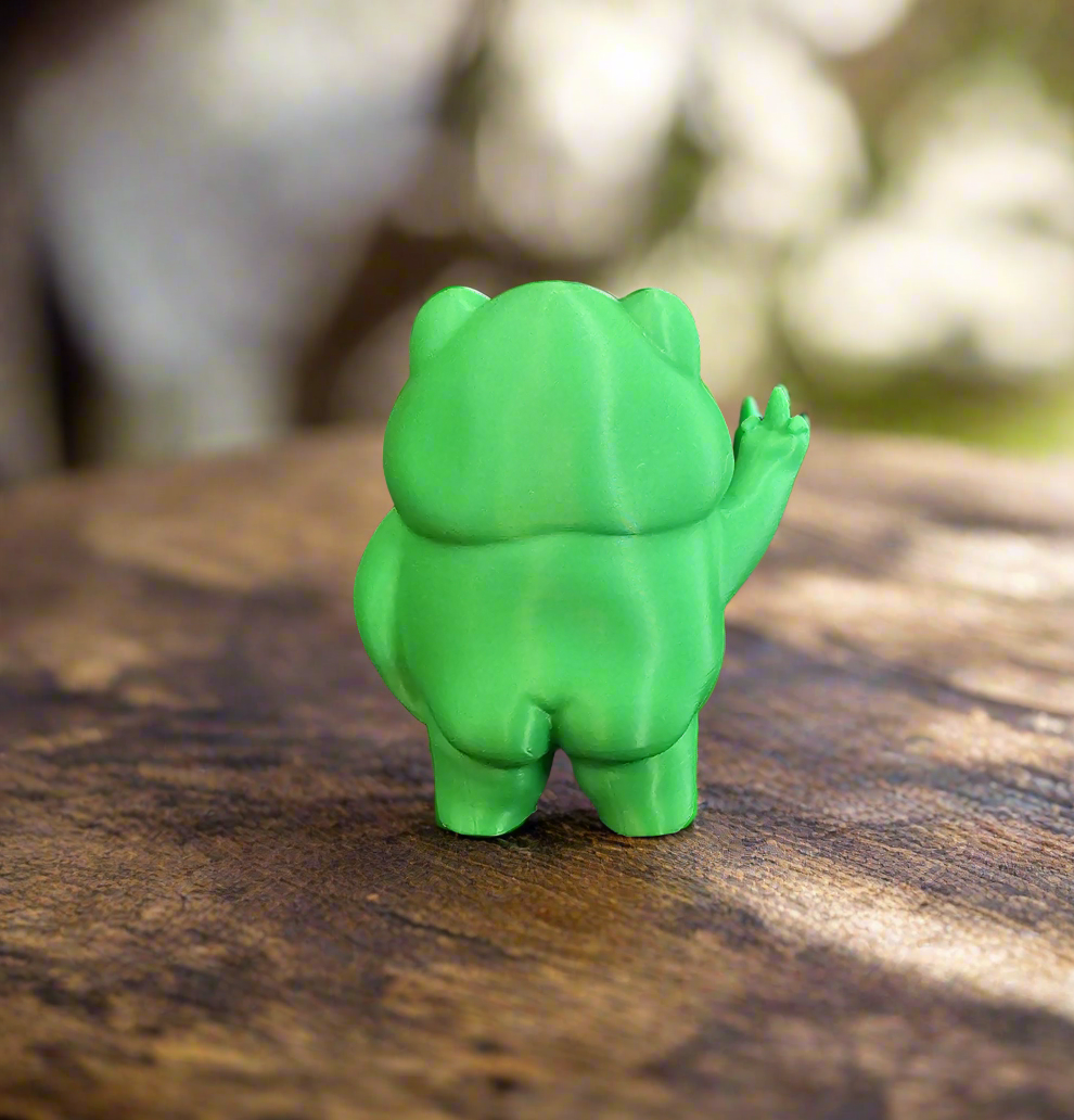 Disgruntled Frog figurine side view showing grumpy expression