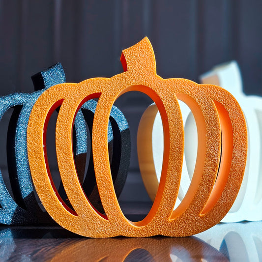 Orange 3D printed Minimalist Pumpkin silhouette with clean lines and autumn-inspired design by VectorDesignsArizona