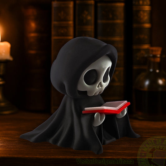 Small hooded grim reaper figurine reading a red book on wooden shelf.
