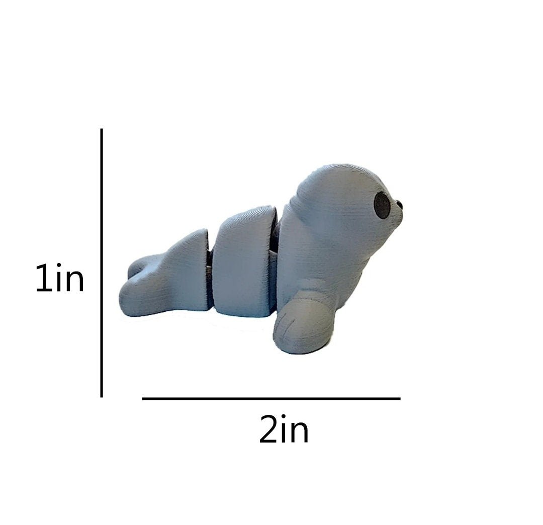 Side view of mini flexy seal toy with 1 inch tall and 2 inch long measurements.