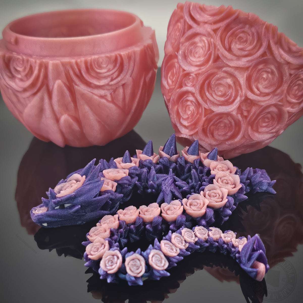 Purple rose dragon flexi figurine with matching pink rose egg on glossy black surface.