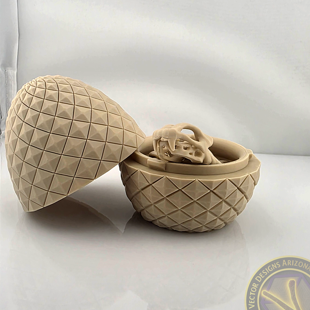 Flexy skeleton dragon curled inside open textured egg on glossy light surface.