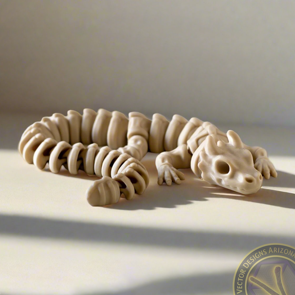 Tan flexy skeleton dragon figurine curled on surface with long shadows.