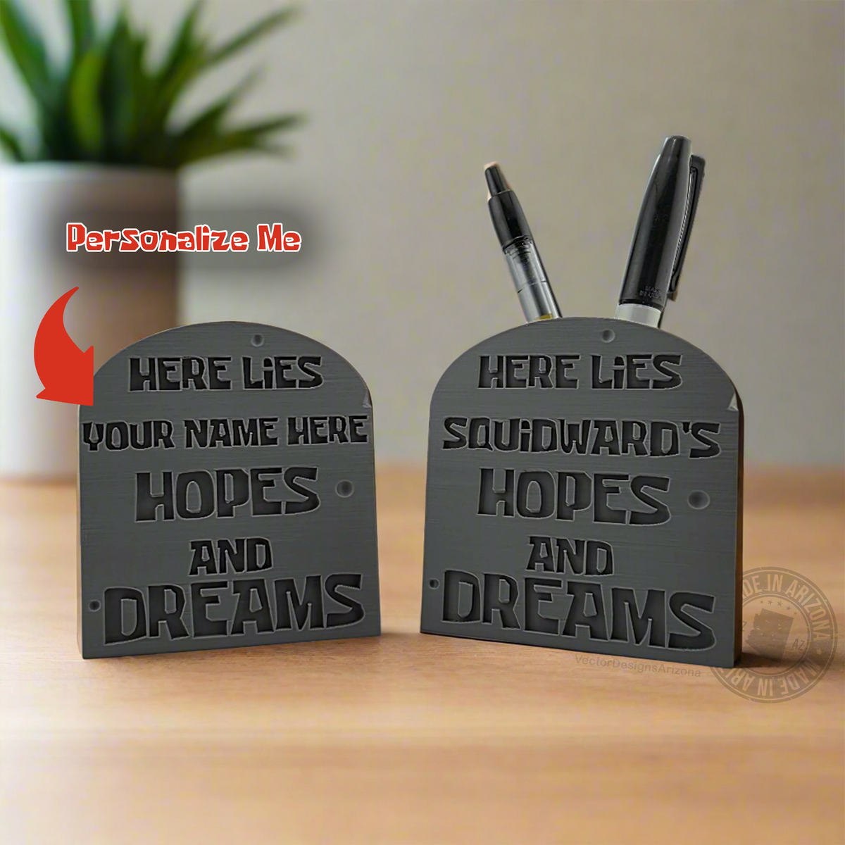 Gray tombstone desk sign and pen holder showing customizable funny epitaph text.