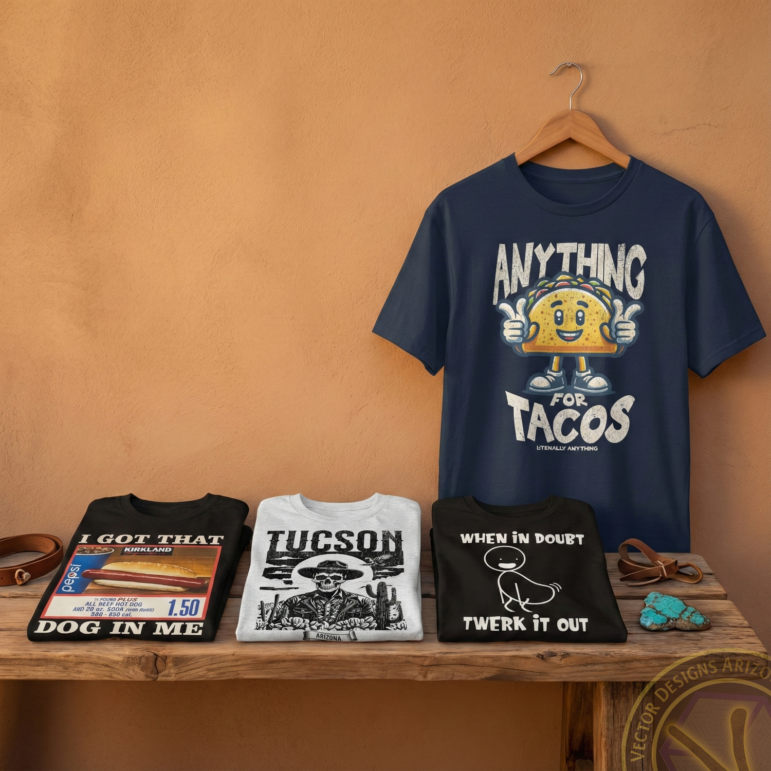 Graphic T-shirt apparel collection displayed on shelf with featured hanging shirt.