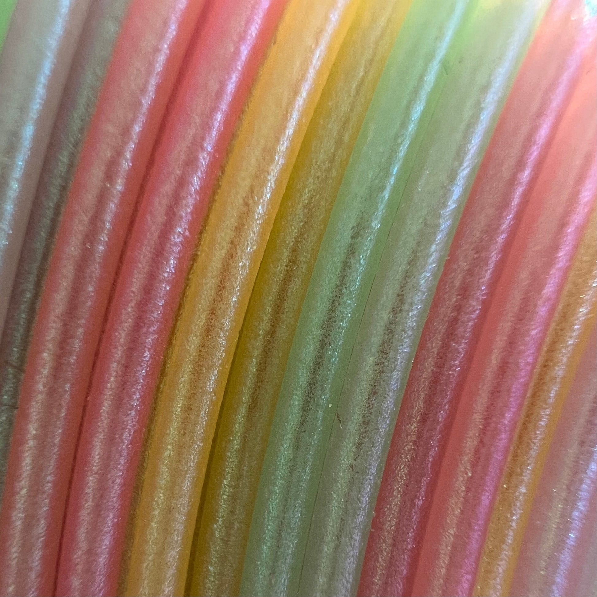 Cookiecad Pastel Rainbow Elixir PLA filament close-up – rainbow gradient with iridescent shimmer