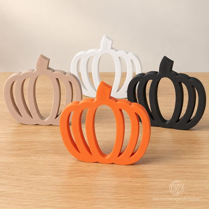 Four minimalist 3D-printed pumpkins in matte black, ivory white, latte brown, and Mandarin orange on a clean studio background.