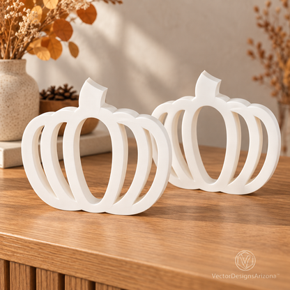 Two ivory white minimalist 3D-printed pumpkins with open-frame designs, styled on a wood console with warm fall decor.