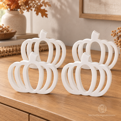 Four ivory white minimalist 3D-printed pumpkins with open-frame designs, styled on a wood console with warm fall decor.