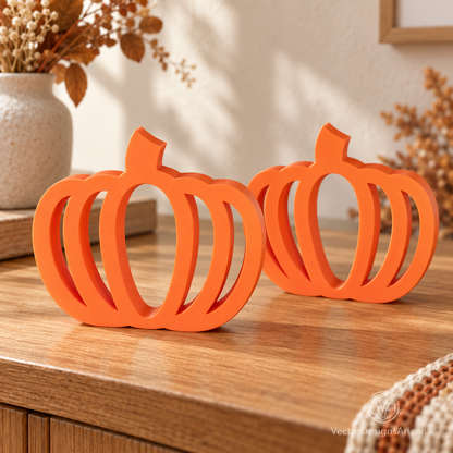 Two Mandarin orange minimalist 3D-printed pumpkins with open-frame designs, styled on a wood console with warm fall decor.