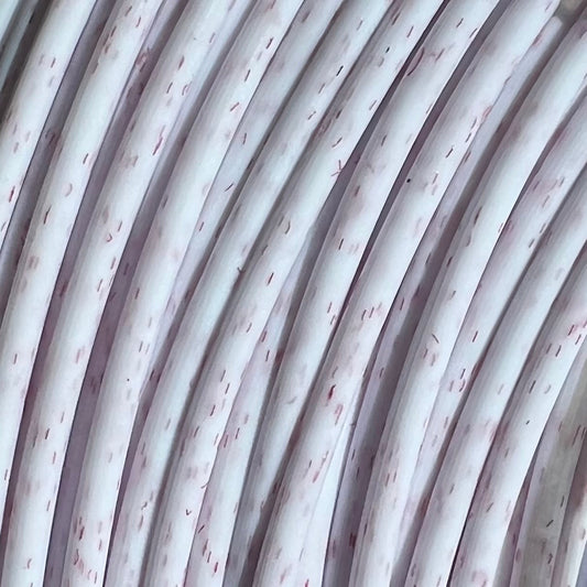 Cookiecad Vanilla Redberry PLA filament close-up – red speckles in creamy white PLA base