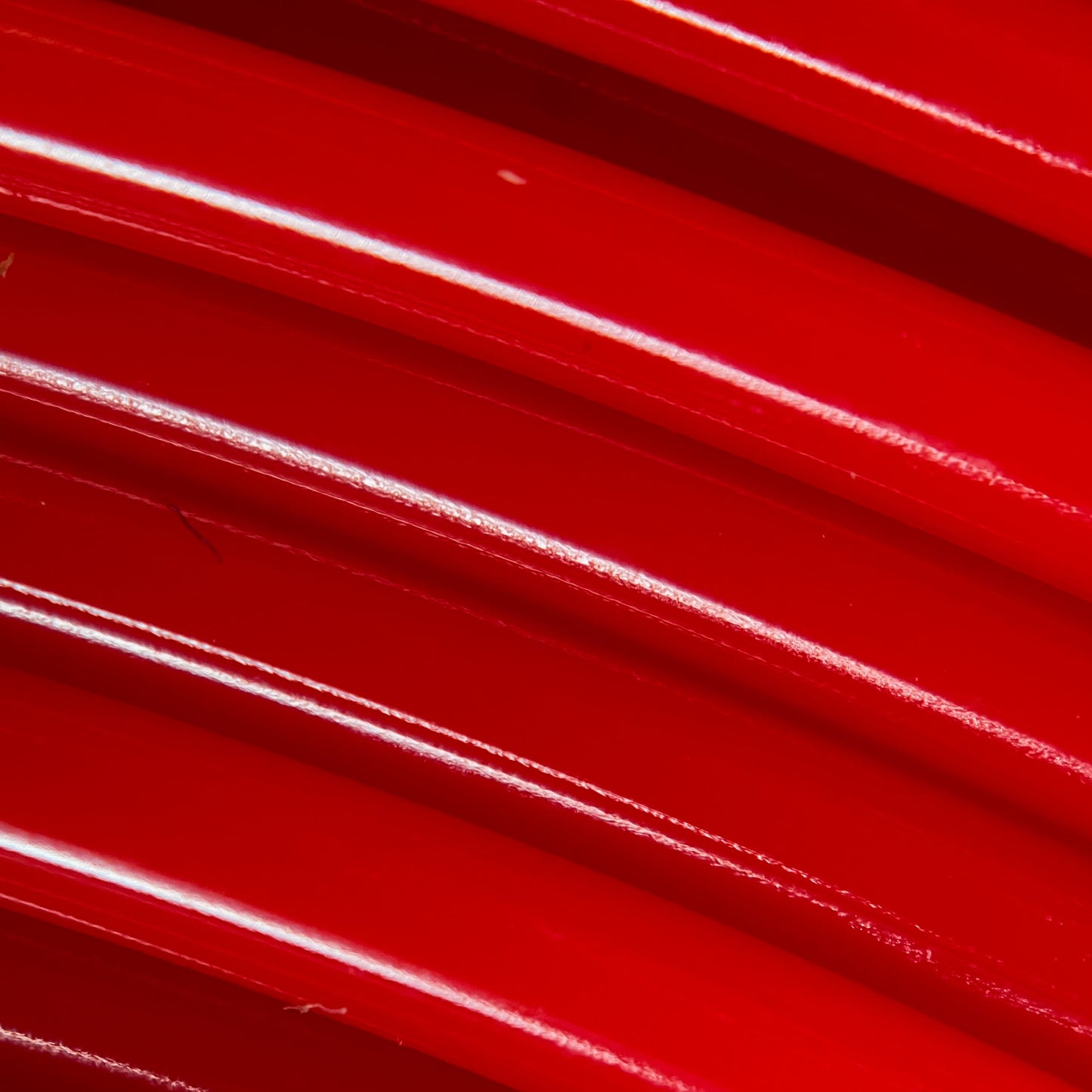 Cookiecad Candy Apple Red PLA filament close-up – glossy red surface detail