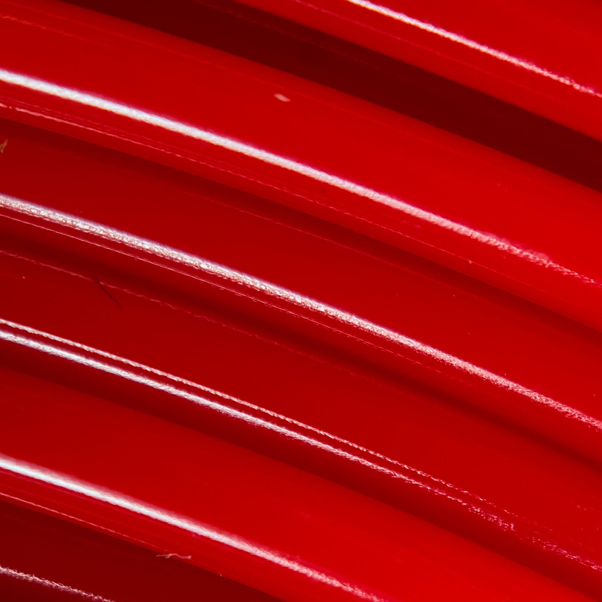 Cookiecad Candy Apple Red PLA filament close-up – glossy red surface detail