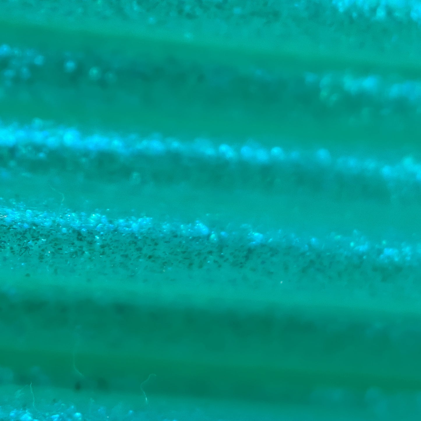 Cookiecad Mint Green Elixir TPU 95A filament close-up – blue-green iridescent shimmer detail