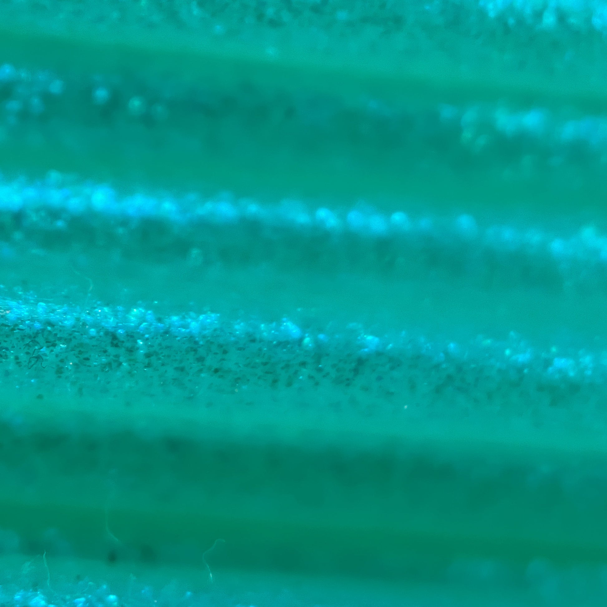 Cookiecad Mint Green Elixir TPU 95A filament close-up – blue-green iridescent shimmer detail