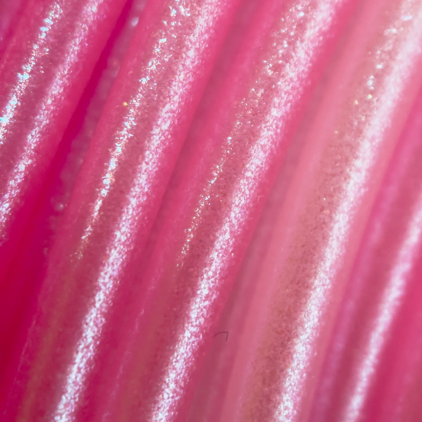 Cookiecad Pink Ombré Elixir PLA filament close-up – iridescent shimmer on pink gradient