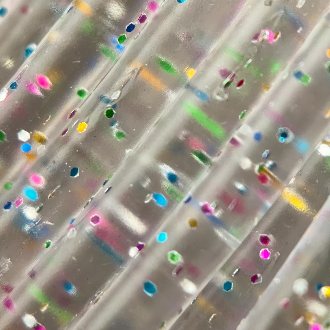 Cookiecad Funfetti PLA filament close-up – rainbow glitter in clear PLA base