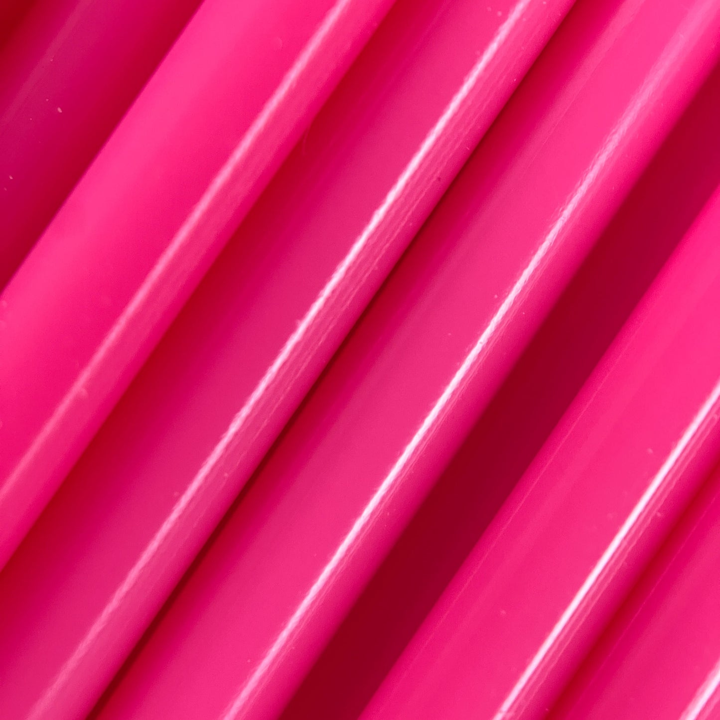 Cookiecad Hot Pink PLA filament close-up – glossy hot pink surface detail