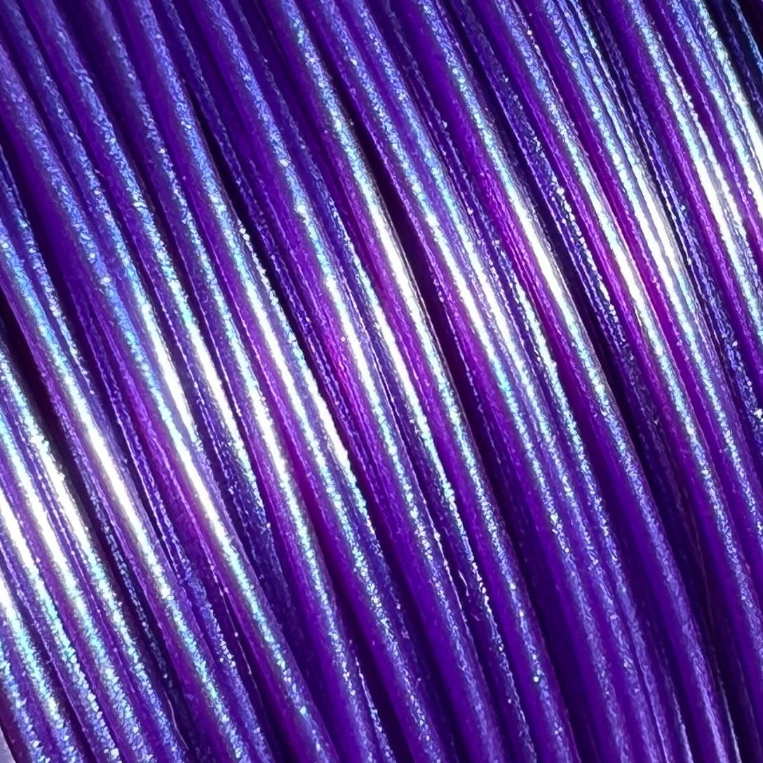 Cookiecad Witches Blue PLA filament close-up – purple mica shimmer on deep blue base