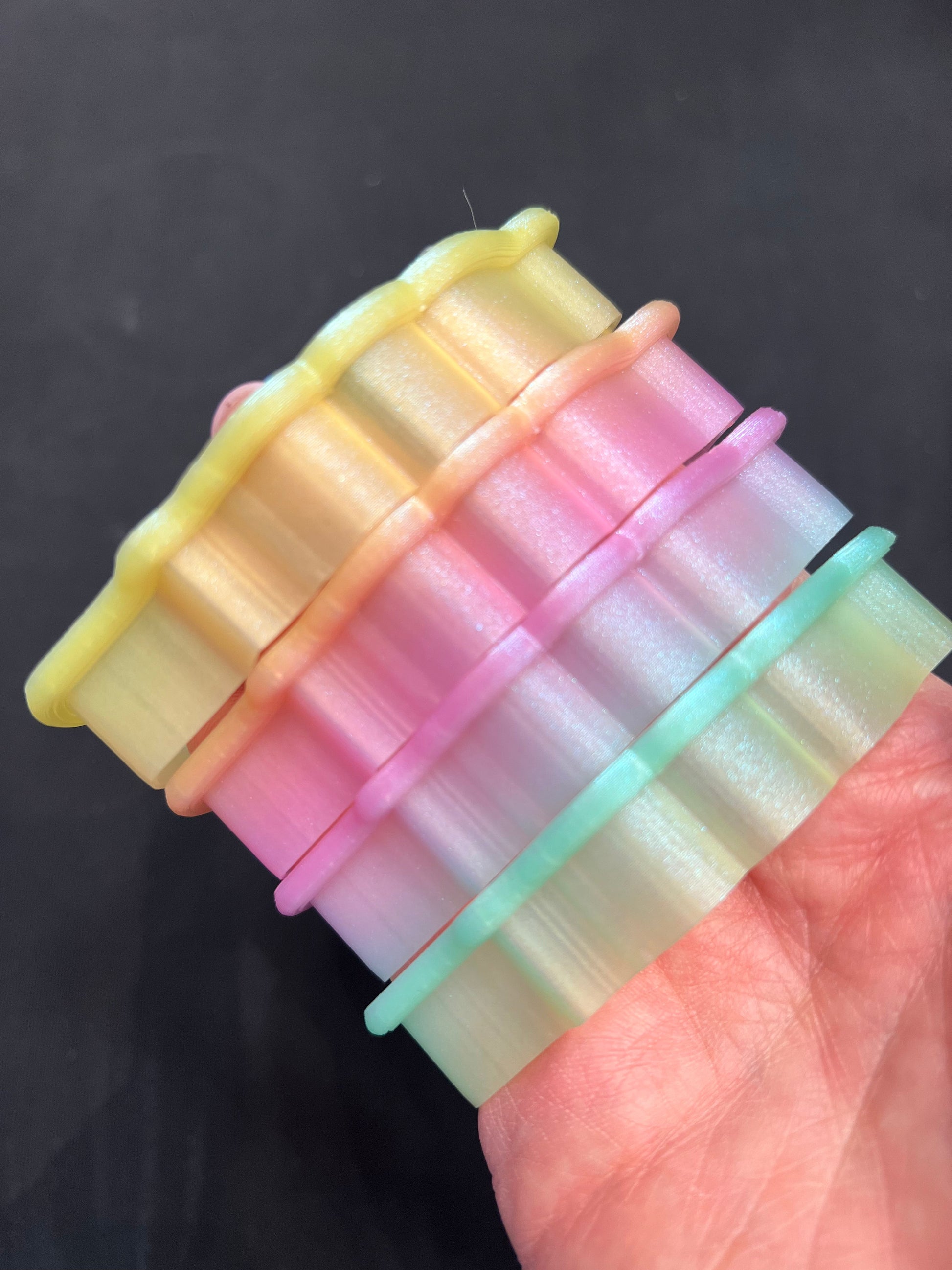 Cookiecad Pastel Rainbow Elixir PLA filament detail – shimmer on rainbow gradient