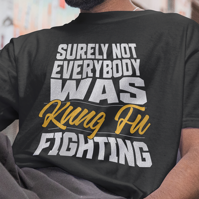 Funny Kung Fu T-shirt with “Surely Not Everybody Was Kung Fu Fighting” quote on black Gildan 5000 tee by VectorDesignsArizona