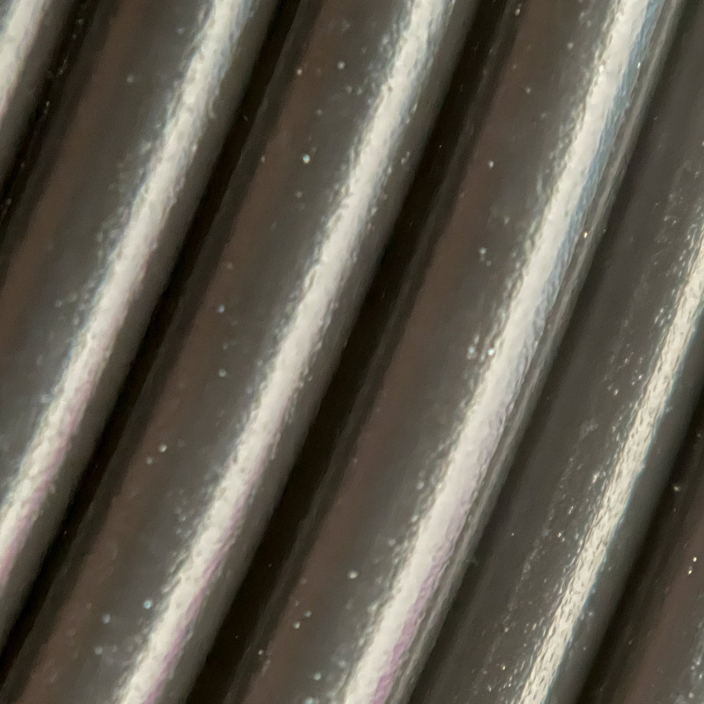 Cookiecad Black PLA filament close-up – clean solid black surface