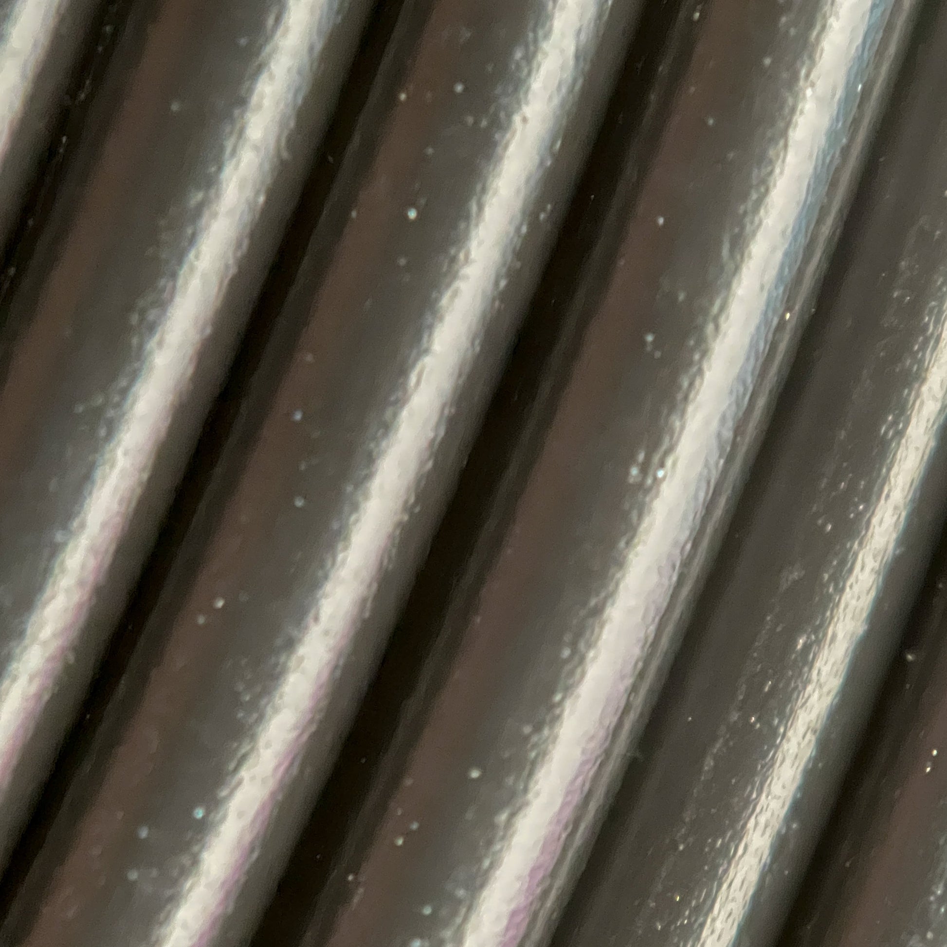 Cookiecad Black PLA filament close-up – clean solid black surface