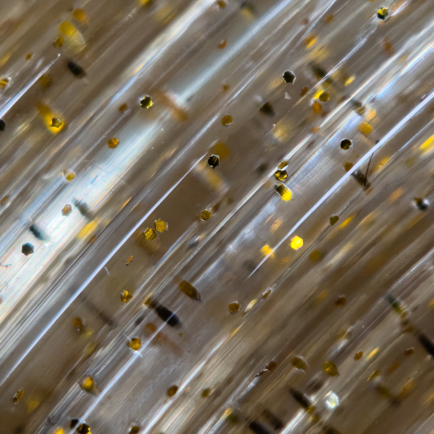 Cookiecad Gold Dust PLA filament close-up – gold glitter in clear PLA base