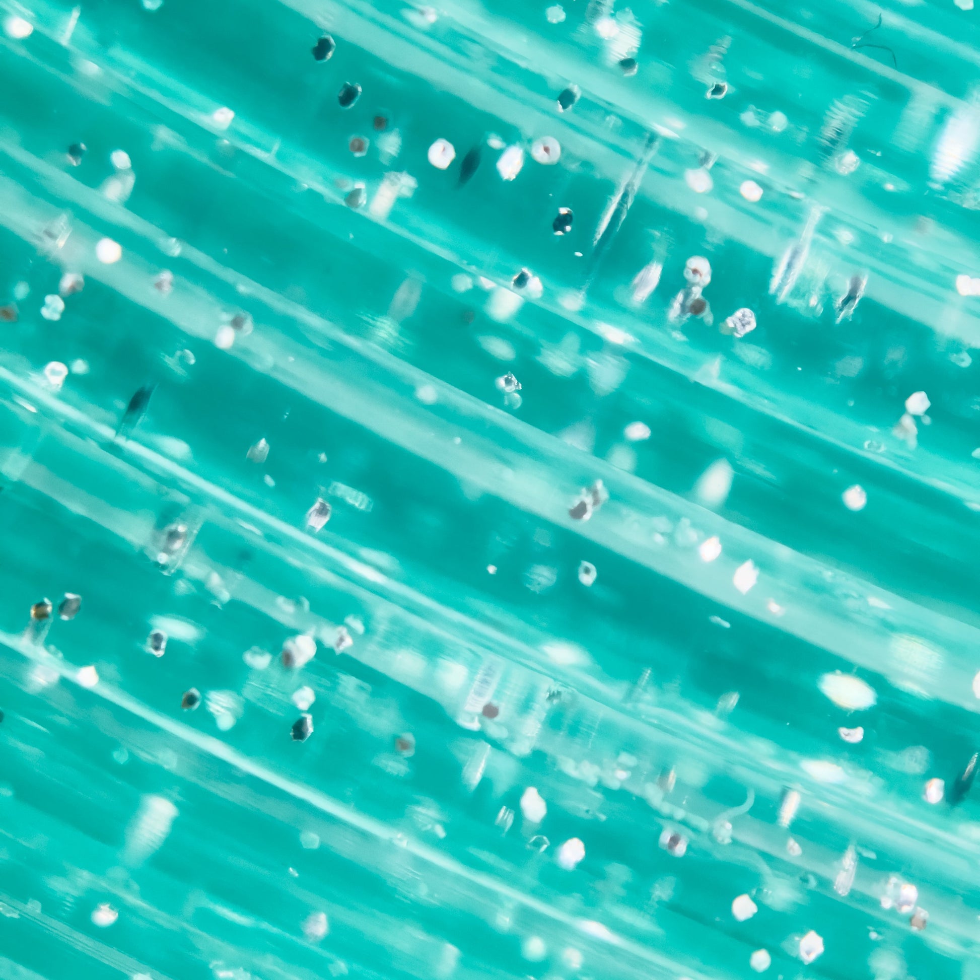 Cookiecad Mint Star Stuff PLA filament close-up – silver glitter in translucent mint base