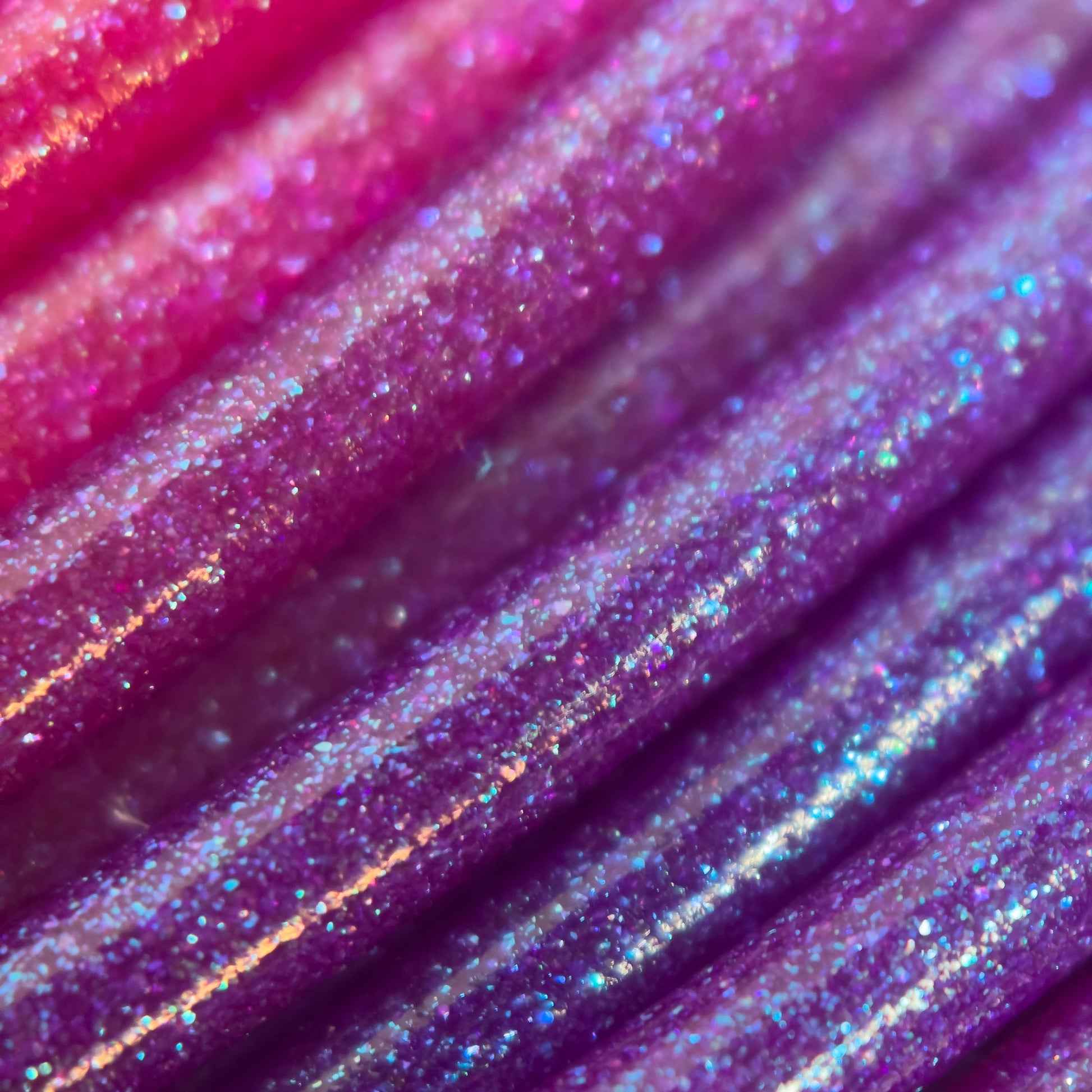 Cookiecad Sunset Elixir ABS filament close-up – iridescent shimmer on gradient base