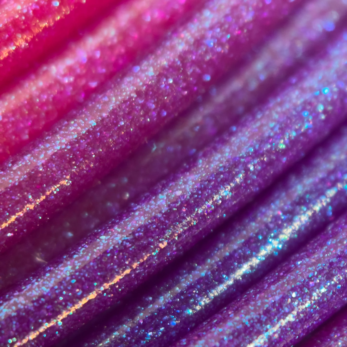 Cookiecad Sunset Elixir PLA filament close-up – iridescent shimmer on gradient base