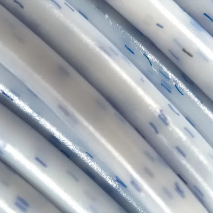 Cookiecad Vanilla Blueberry PLA filament close-up – blue-purple speckles in creamy white PLA base