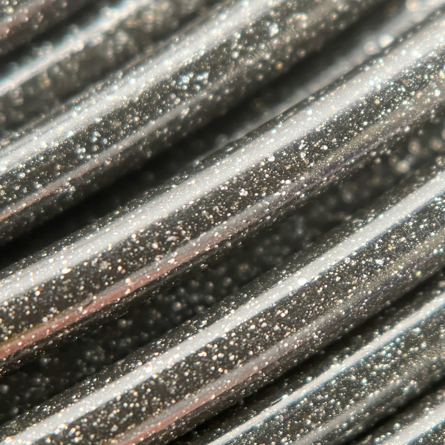 Cookiecad Star Dust Glitter Black PLA filament close-up – fine glitter in deep black base