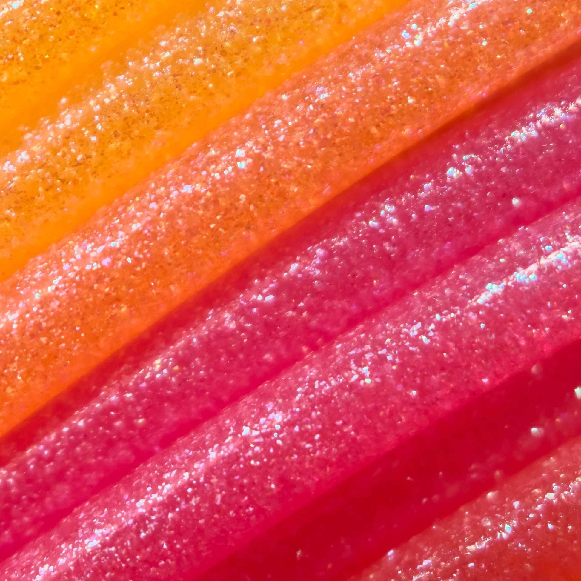 Cookiecad Sunrise Elixir PLA filament close-up – iridescent shimmer on warm sunrise gradient
