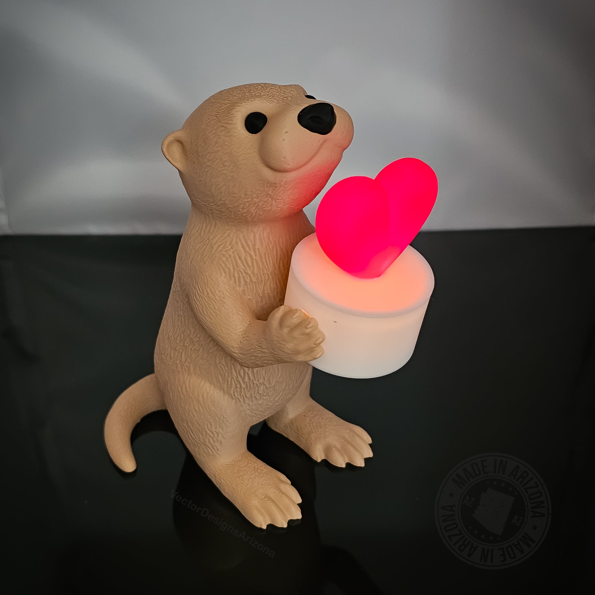 Otterly in Love LED otter figurine glowing in low light, cozy romantic ambiance