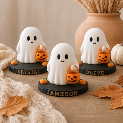 Three Trick-or-Treat Ghost figurines on personalized stands labeled Krystal, Jameson, and Olive.