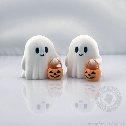 Pair of tiny 3D printed Halloween ghost figurines with pumpkin buckets, eco-friendly PLA decor for spooky fall displays.