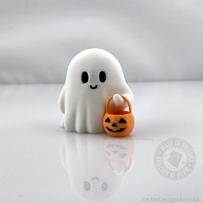 Cute 3D printed ghost figurine holding an orange jack-o’-lantern bucket, handmade Halloween desk or shelf decoration by VectorDesignsArizona.