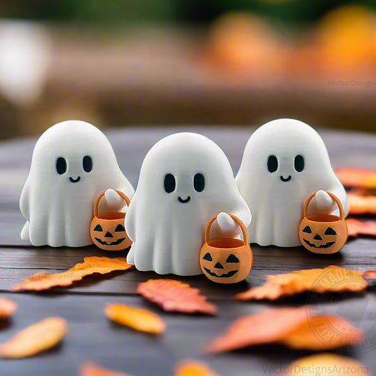 Group of three tiny 3D printed Halloween ghost figurines holding pumpkin buckets, styled with autumn leaves for cozy fall home decor.