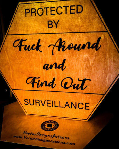 VectorDesignsArizona Laser-etched birch wood sign with bold funny ‘Protected by Surveillance’ warning message, 12x12 inch plaque coated for indoor and outdoor use by Vector Designs Arizona 