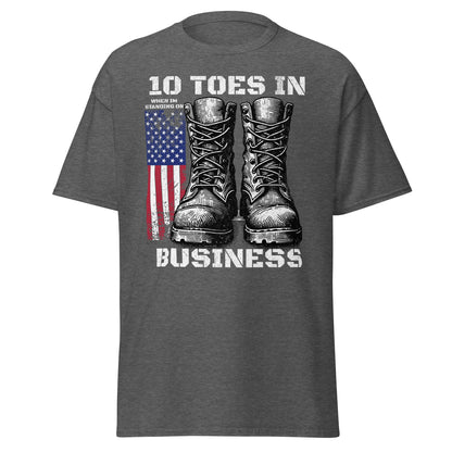Dark heather patriotic T-shirt with boots and American flag graphic on white background.