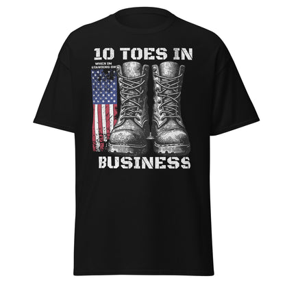 Black patriotic T-shirt with boots and American flag graphic on plain white background.