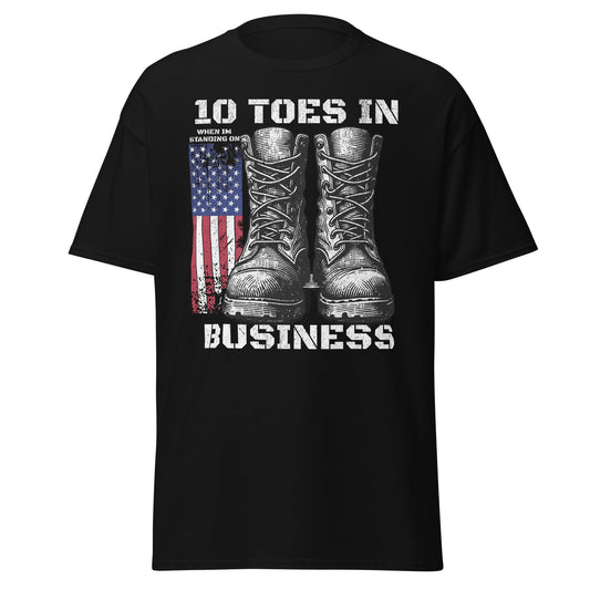 Black patriotic T-shirt with boots and American flag graphic on plain white background.