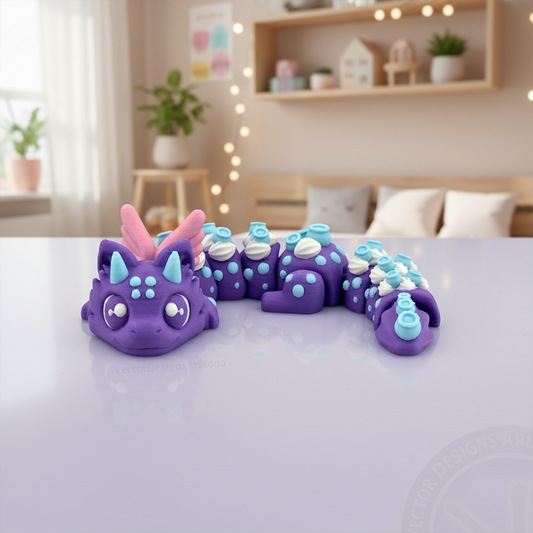 Purple Blueberry Dragon 3D printed flexi fidget displayed on a glossy desk in a cozy bedroom with soft lights in the background.