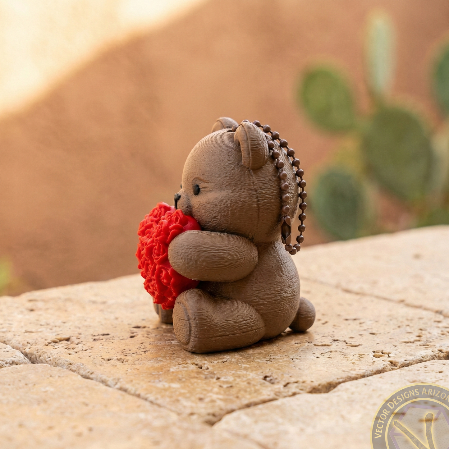 Side profile of a brown bear bag charm holding a rose heart, showing the durable 3D printed texture perfect for daily use.