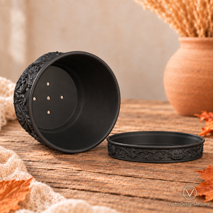 Matte black planter resting on its side, showing five drainage holes and the separate matching saucer.
