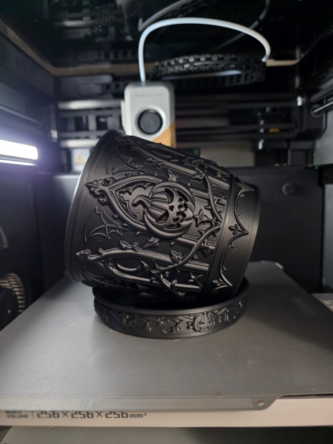 Actual angled view of planter relief and matching saucer